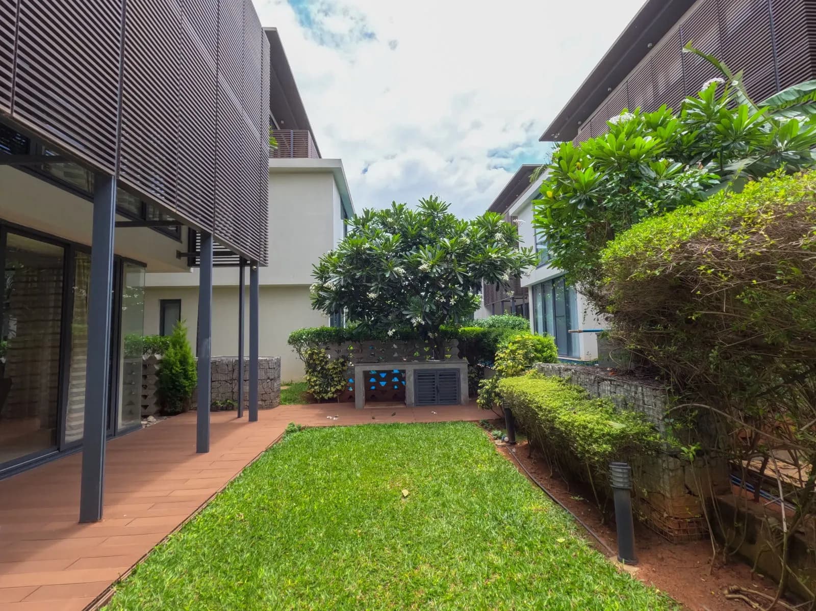 Landscaped private gardens between contemporary villas at Embassy Boulevard, Yelahanka