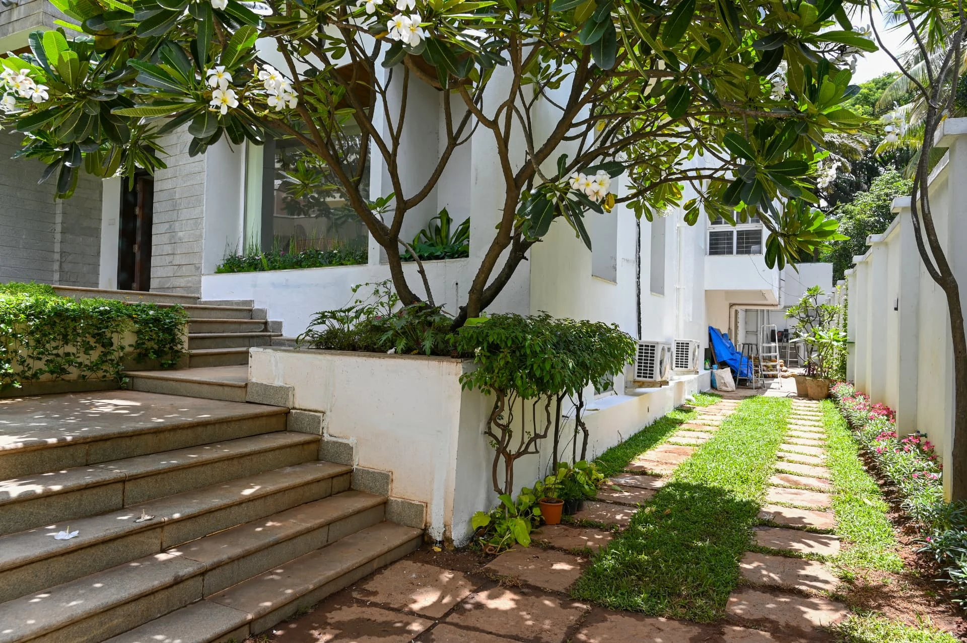 Granite entry steps and stepping-stone path along the side garden, Prestige Laughing Waters luxury villa for rent, Whitefield, Bangalore