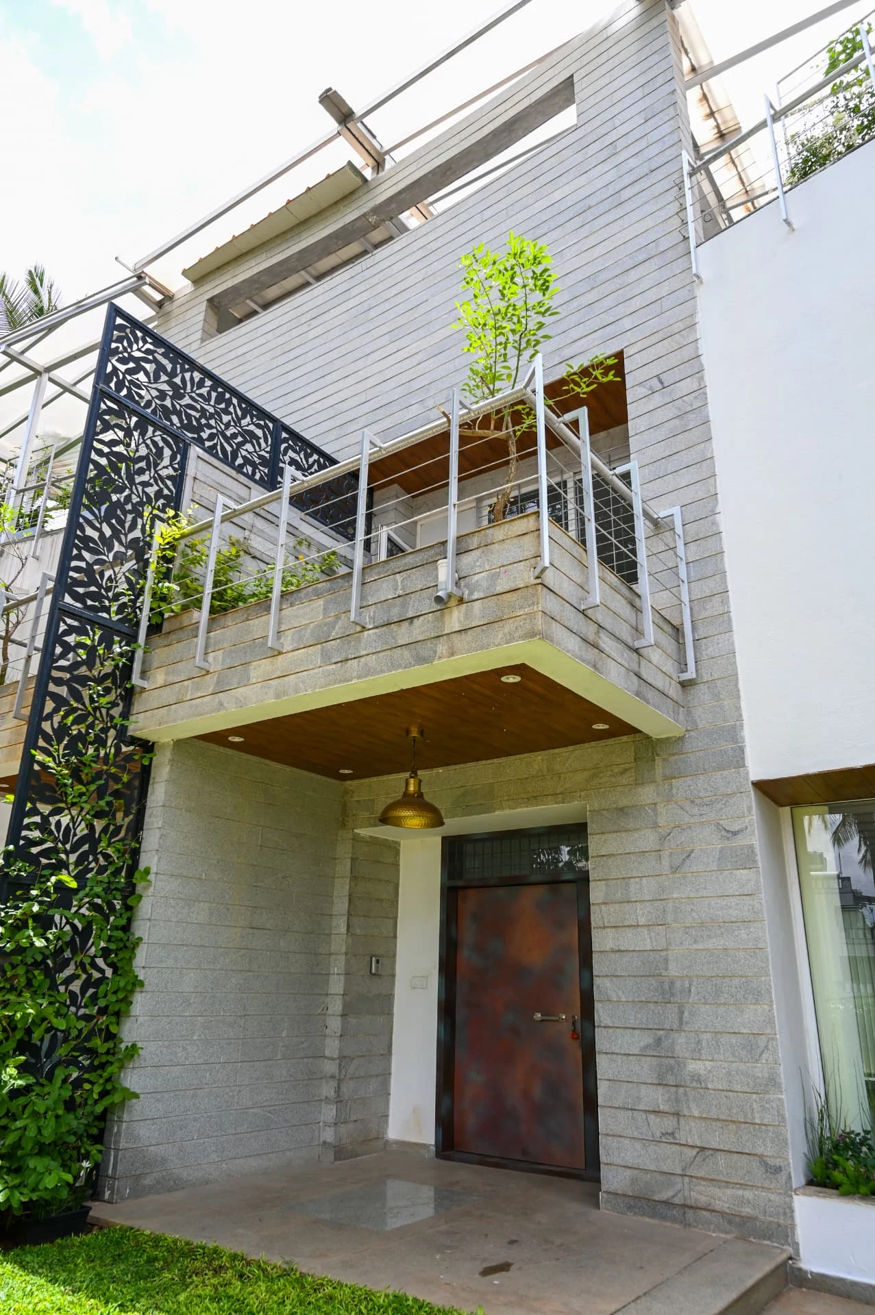 First-floor terrace above the entrance porch with laser-cut screen, Prestige Laughing Waters luxury villa for rent, Whitefield, Bangalore