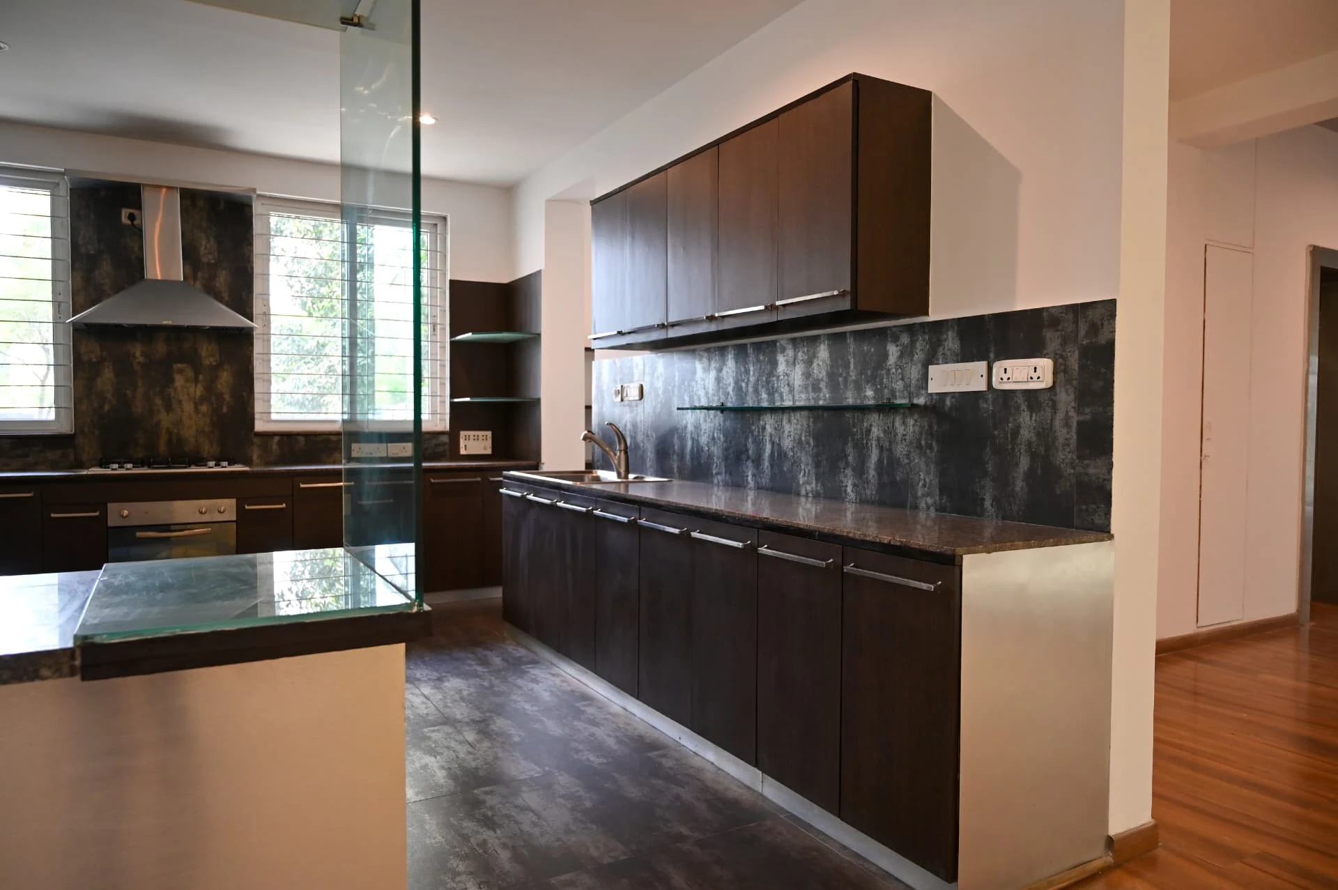 Second villa open kitchen with dark cabinetry and central island, Laughing Waters twin villas for sale, Whitefield, Bengaluru