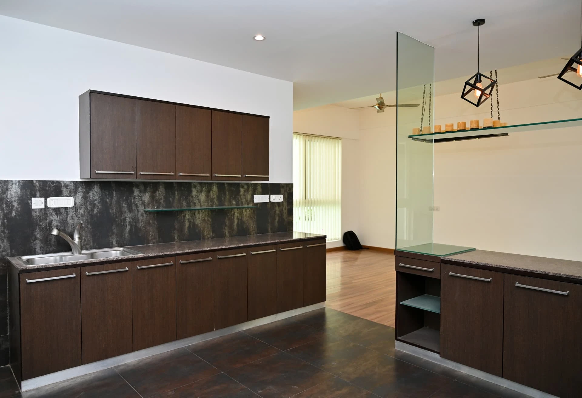 Kitchen cabinetry with metallic tiled splashback and glass shelving, Prestige Laughing Waters luxury villa for rent, Whitefield, Bangalore