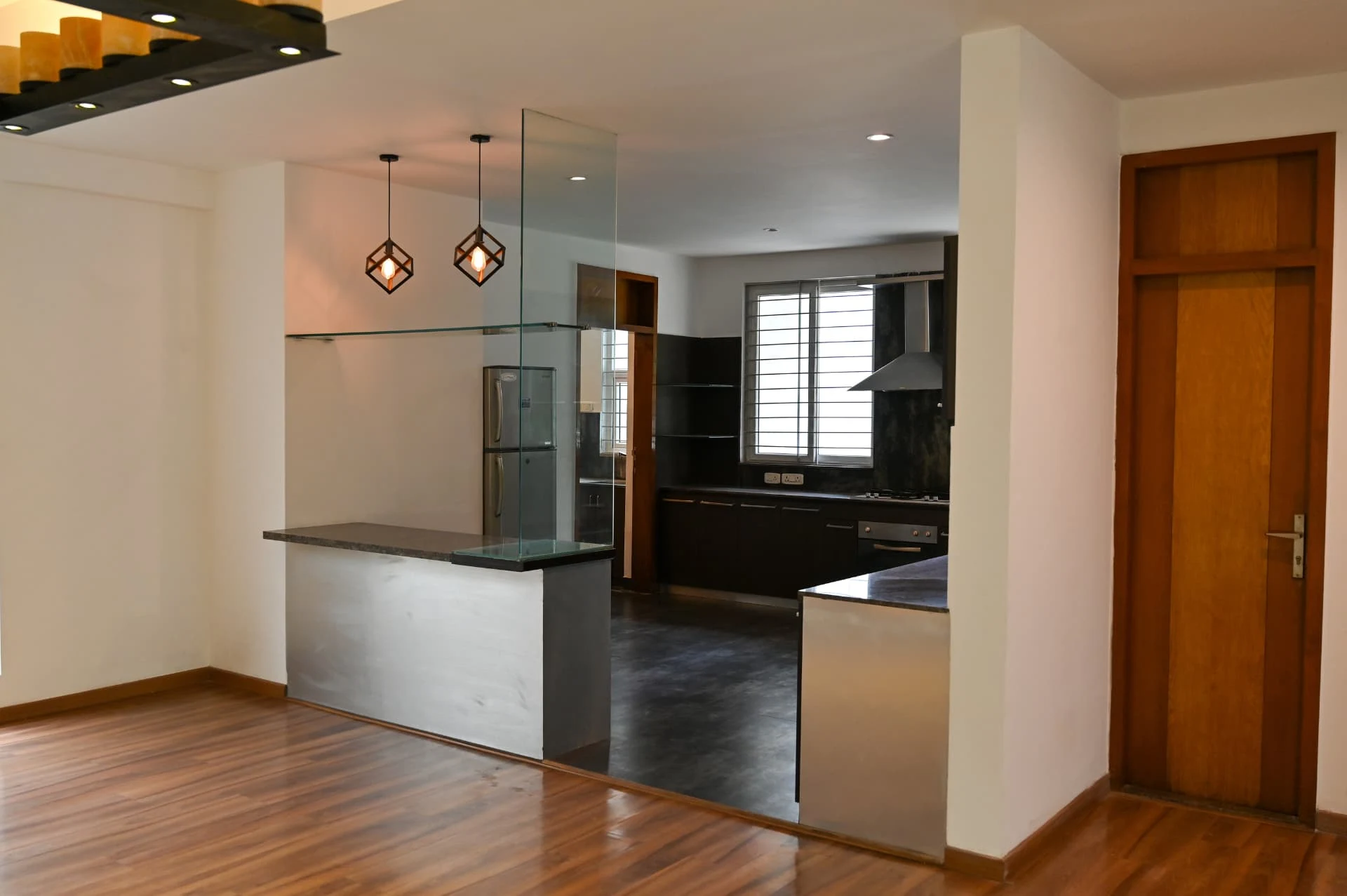 Breakfast bar with glass partition leading into the kitchen, Prestige Laughing Waters luxury villa for rent, Whitefield, Bangalore