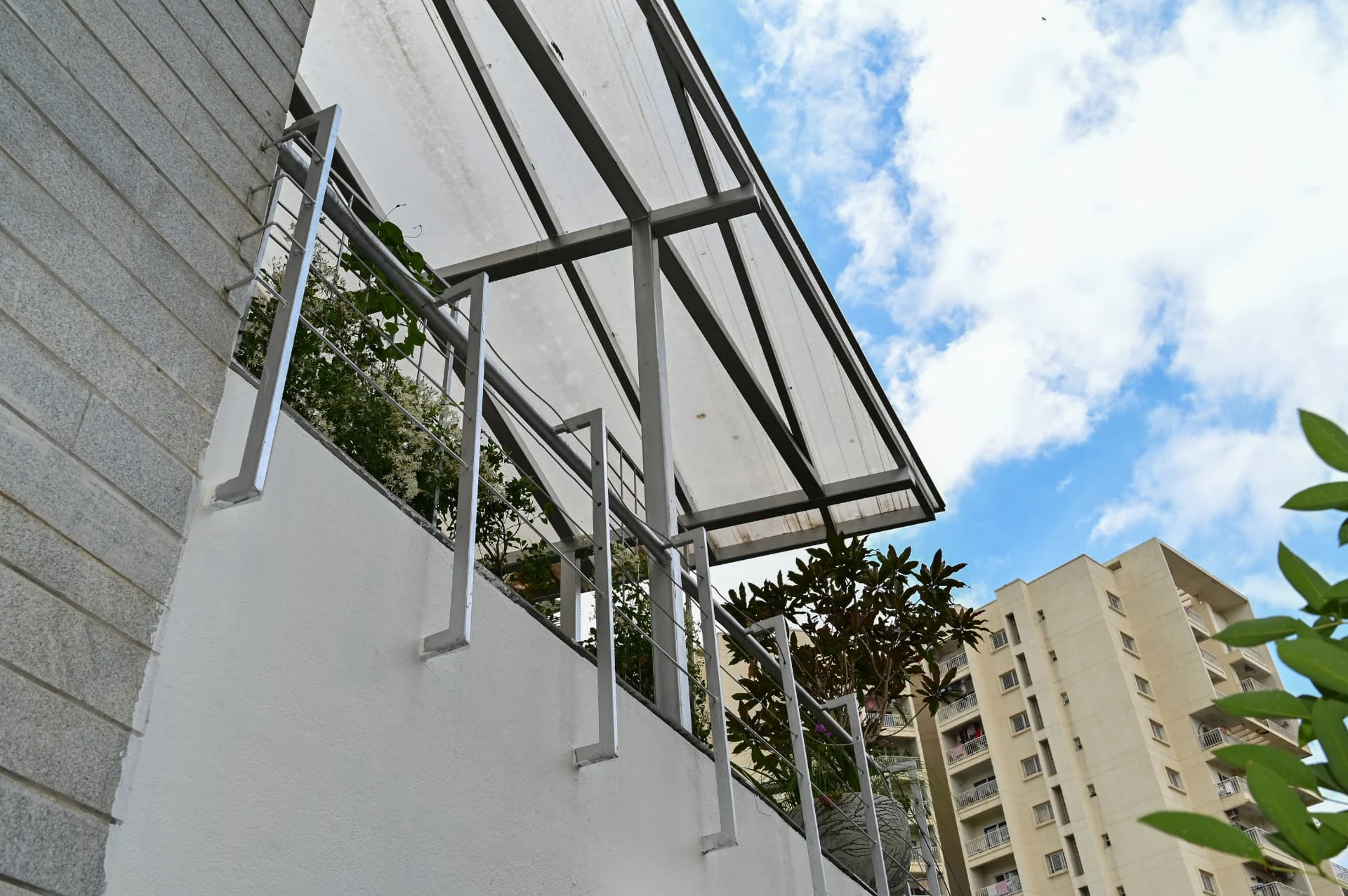 Steel pergola and planted balustrade along the upper terrace, Prestige Laughing Waters luxury villa for rent, Whitefield, Bangalore