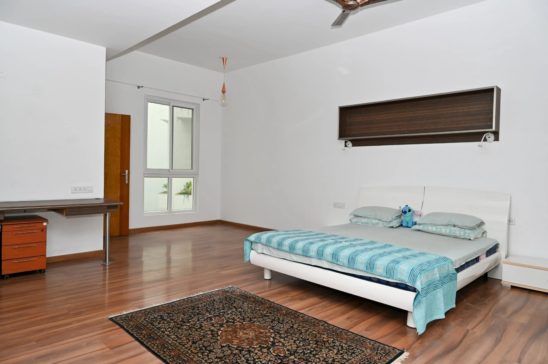 Master bedroom with study desk, wall unit and private window, Prestige Laughing Waters luxury villa for rent, Whitefield, Bangalore