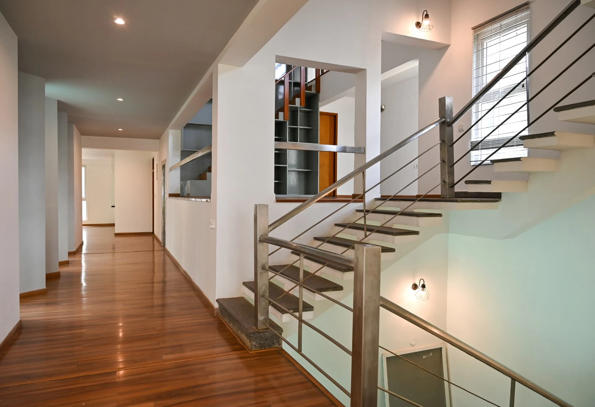Floating stone staircase with steel balustrade and long corridor, Prestige Laughing Waters luxury villa for rent, Whitefield, Bangalore
