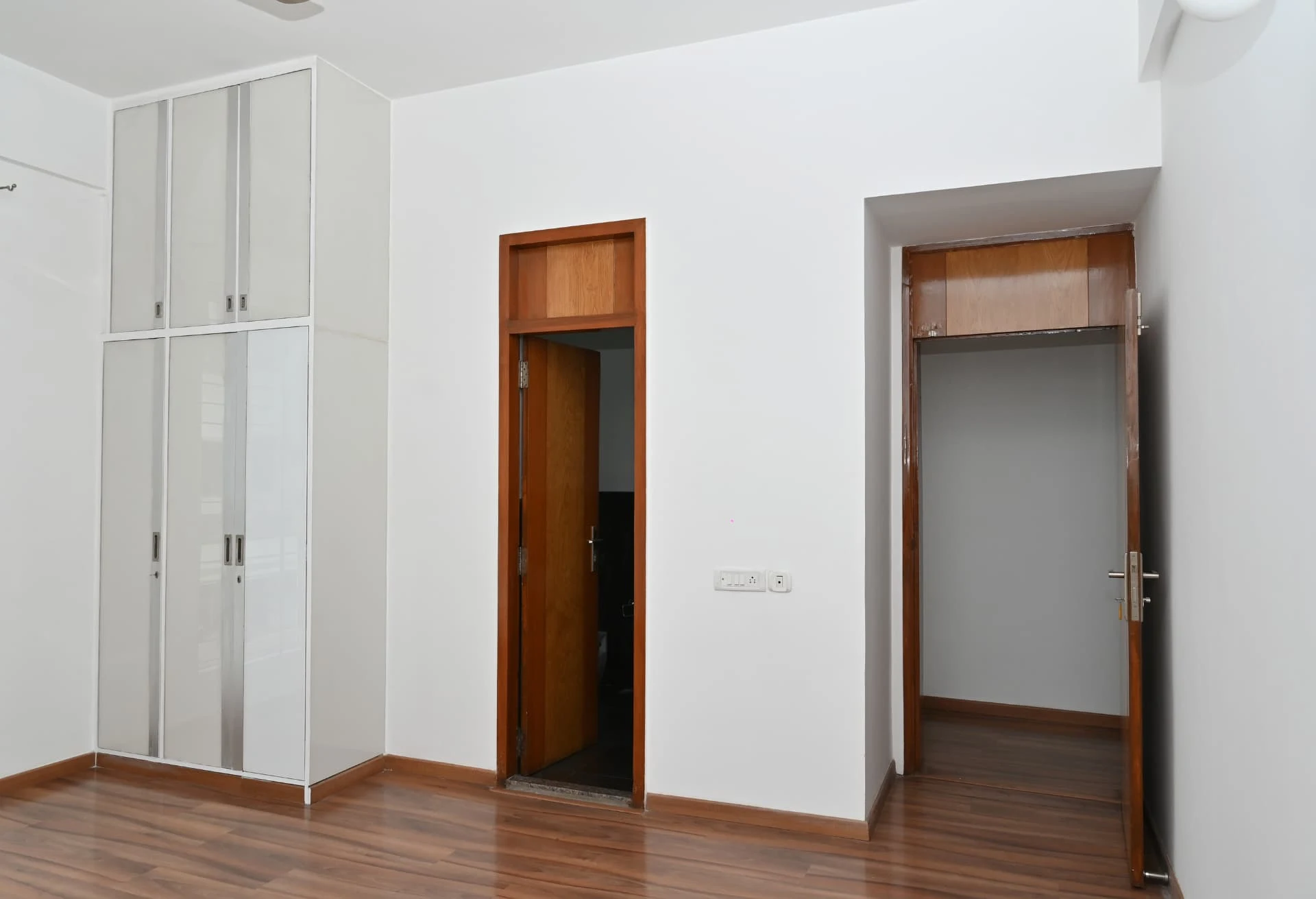 Bedroom with fitted wardrobes and doors to en-suite and dressing area, Prestige Laughing Waters luxury villa for rent, Whitefield, Bangalore